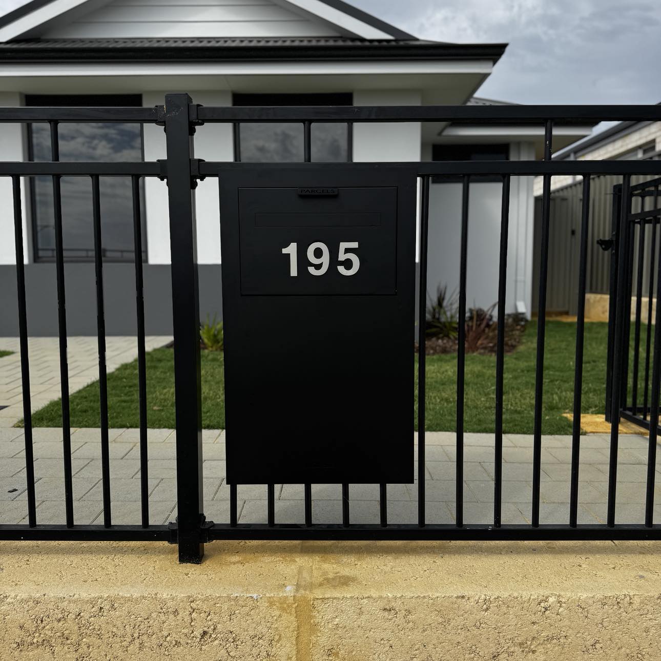 Milkcan Zurich Parcel & Mail Fence / Brick