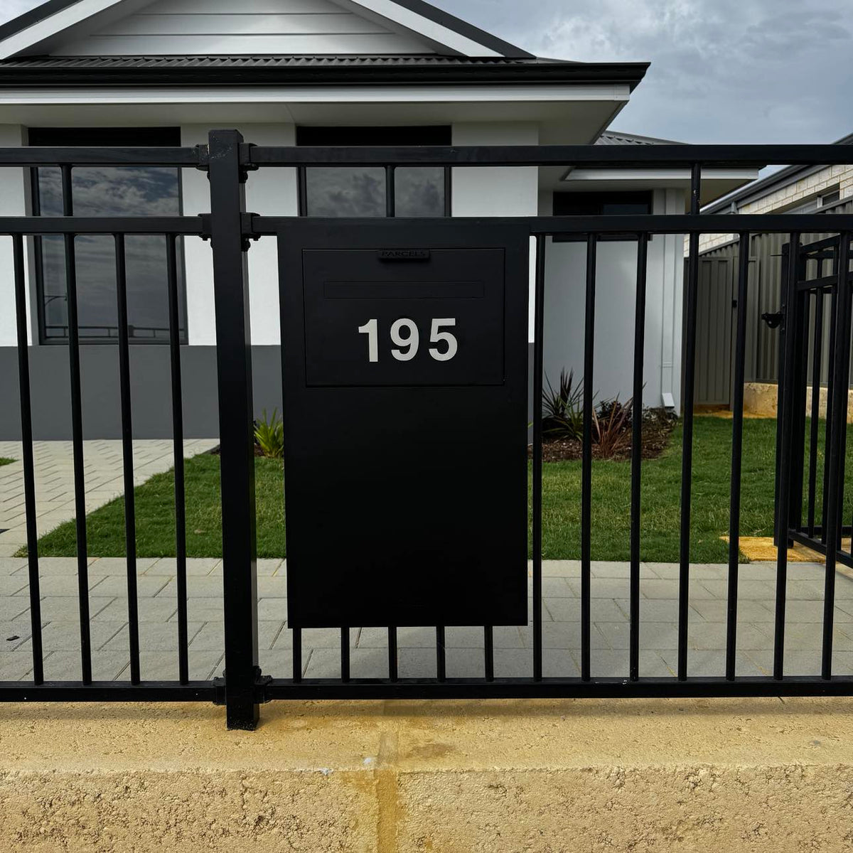 Milkcan Zurich Parcel & Mail Fence / Brick