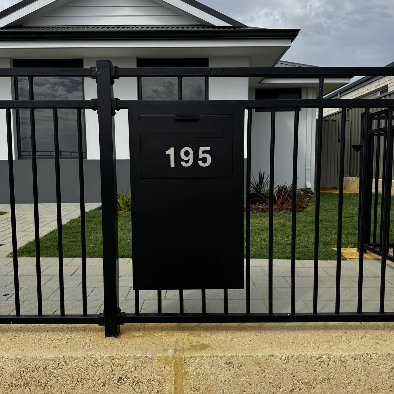 Milkcan Zurich Parcel & Mail Fence / Brick