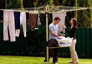 Austral Foldaway 45 Classic Cream people hanging clothes on line in backyard-Aussie Clotheslines & Letterboxes