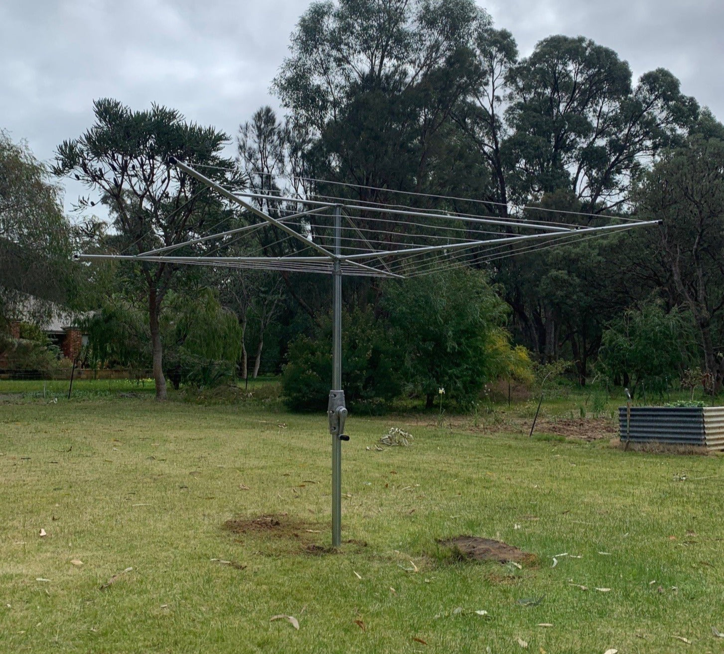 Austral Super 4 Rotary Clothesline installed into lawn-Aussie Clotheslines & Letterboxes