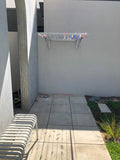 City Living Studioline Medium wallmounted onto rendered wall-Aussie Clotheslines & Letterboxes
